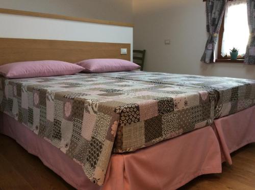 Postel nebo postele na pokoji v ubytování Giuliva B&B