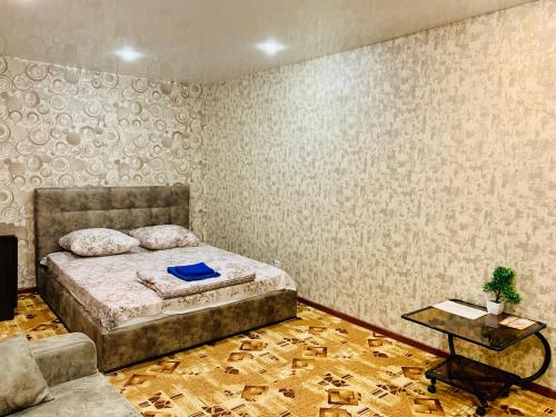 Voodi või voodid majutusasutuse Apartment TwoPillows on Timanskaya 4B toas