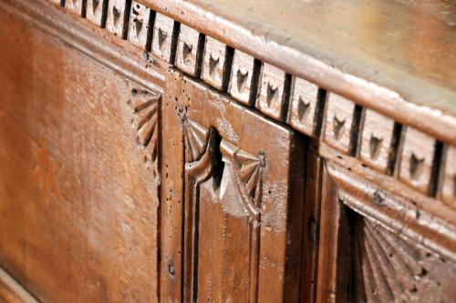 a close up of a wooden table with a wooden door at Case di Berto in Capo Vaticano