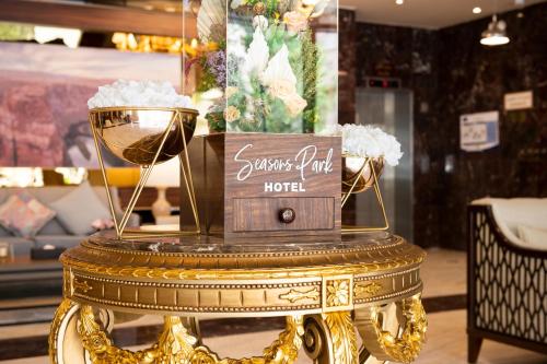 a gold table with a box on top of it at mawasim al hay at hotel in Jeddah