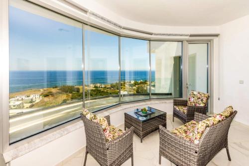 a room with a view of the ocean at Elite Sea View Villa in Pomos