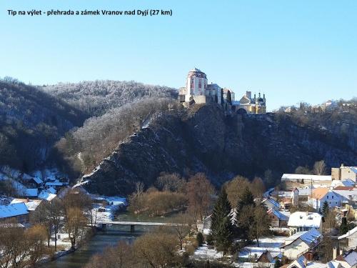 a castle on top of a mountain with a town at apartmán U Rané BOBULE in Znojmo