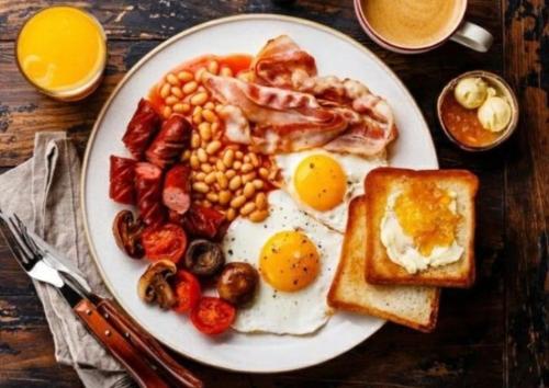 a plate of breakfast food with eggs beans and toast at Coral Castle - Goidhoo Maldives in Baa Atoll