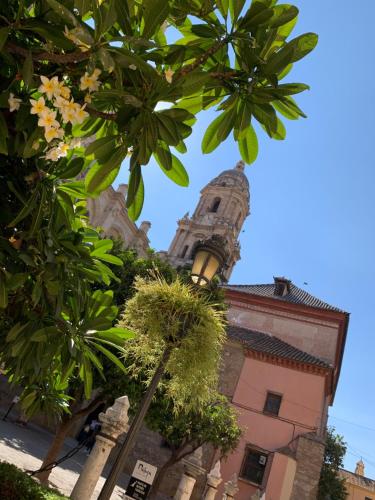 a tall building with a street light in front of it at Picasso City Center 1A in Málaga