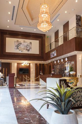 a lobby of a hotel with a potted plant at mawasim al hay at hotel in Jeddah