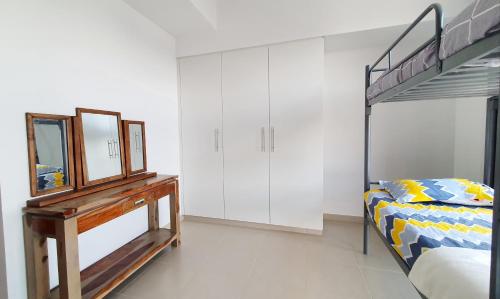 a bedroom with a bunk bed and a mirror at Spacious 2 Bedroom Apartment DXB in Dubai