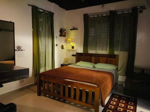A bed or beds in a room at Cornwall Coorg