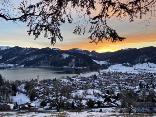 a city in the snow at sunset at Apartment Berg und See in Schliersee
