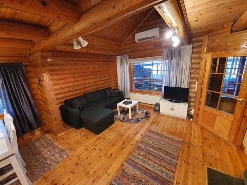 an overhead view of a living room with a couch and a television at Koivuranta in Pihtipudas