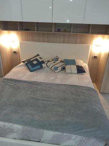 a bed with two pillows on top of it at residence San miniato in Loro Ciuffenna