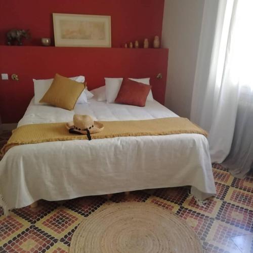 a bed with a teddy bear sitting on top of it at LA TERRASSE VIGNERONNE in Fitou