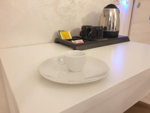 Příslušenství pro přípravu čaje a kávy v ubytování Bergamo City - Self Check-in