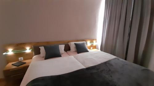 Ένα ή περισσότερα κρεβάτια σε δωμάτιο στο Strandvilla Merva