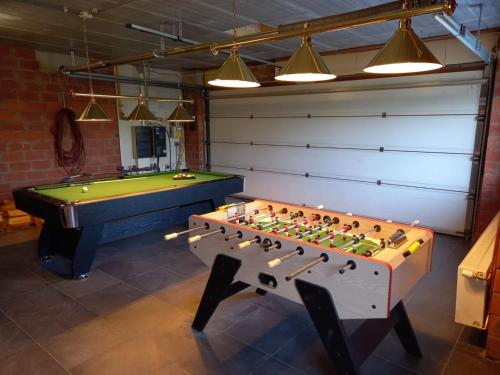 a room with a pool table at Welcoming Villa in Puivelde with Terrace Garden Barbeque in Puivelde