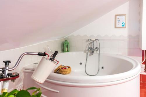 a bathroom with a bath tub with a lamp at Moneda 46 in Cuenca