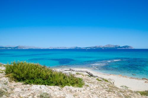 a view of the ocean from a beach at Llaut Boutique Hotel in Can Picafort