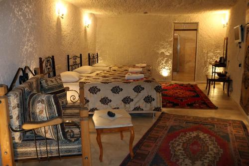 Katil atau katil-katil dalam bilik di Melek Cave Hotel