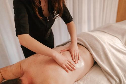 a woman sitting on top of a mans stomach at Hiwinui Country Estate in Palmerston North