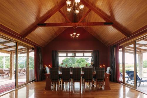 a dining room with a table and chairs at Hiwinui Country Estate in Palmerston North