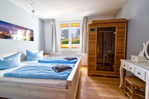 Кровать или кровати в номере Meerforelle 207 - Villa Seeblick