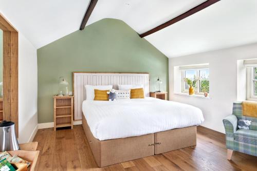 a bedroom with a large bed and a window at Shoulder of Mutton Inn in Harrogate