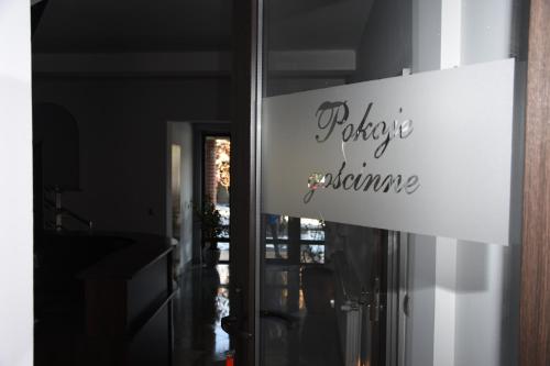 a sign on the door of a house at Dom Przyjęć Pradziad in Rogów