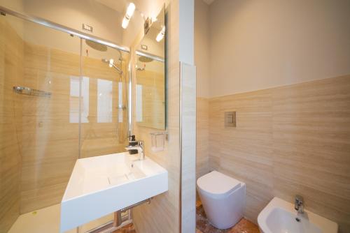 a bathroom with a sink and a toilet at Residence Sferisterio in Macerata