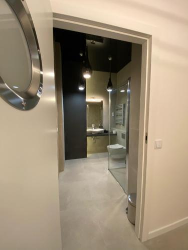 a bathroom with a toilet and a sink in a room at The Baltic Horizon in Dziwnówek