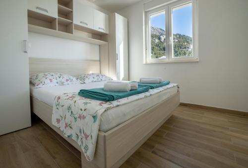 Postel nebo postele na pokoji v ubytování Apartman Nimfa Živogošće