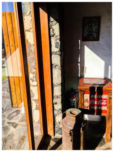 a door to a room with a fire hydrant in front of it at Beautiful Cabin Downtown Tapalpa Oven Mud Barbecue Grill 4 Room 12 ppl TV Wifi in Tapalpa