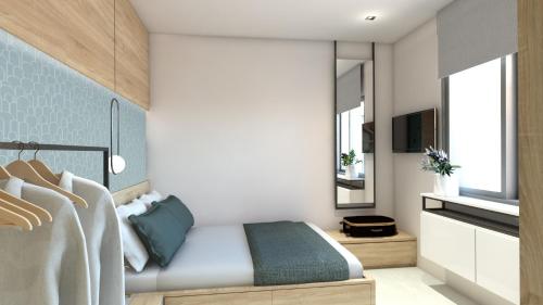 a bedroom with a bed and a tv at 7Rizes Luxury Living in Heraklio Town