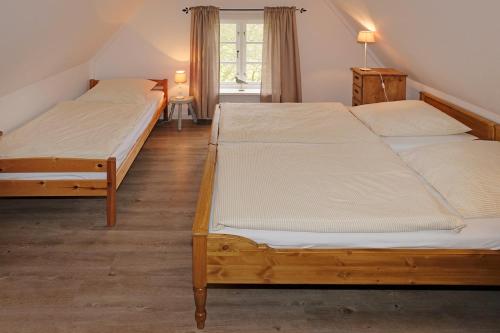 Alte Stellmacherei tesisinde bir odada yatak veya yataklar
