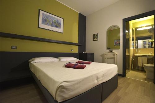 Ein Bett oder Betten in einem Zimmer der Unterkunft Hotel Imperiale & SPA
