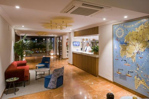 a lobby with a map of the world on the wall at Hotel Osiris Ibiza in San Antonio