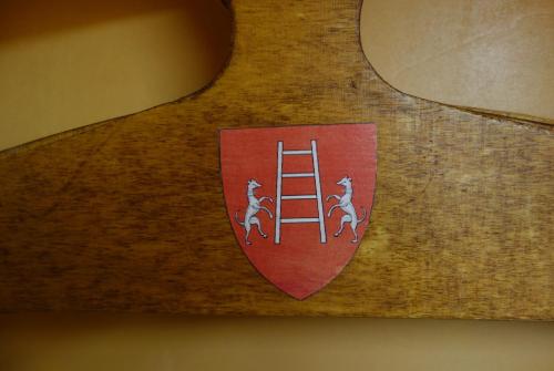 a shield with two horses on a ladder at Euromotel Croce Bianca in Verona