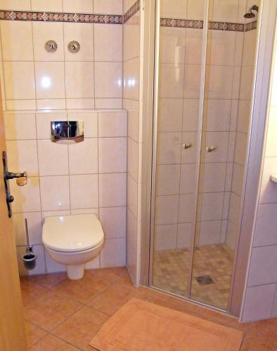 a bathroom with a shower and a toilet at Landhaus Oberrainer in Bad Griesbach