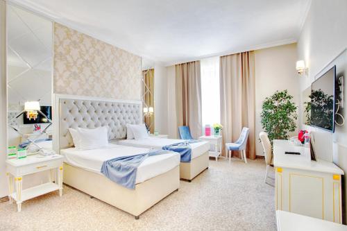 En eller flere senge i et værelse på Ramada by Wyndham Plovdiv Trimontium