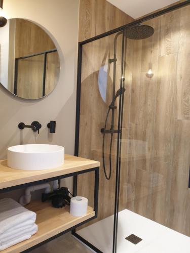 a bathroom with a shower and a sink at Snooze in Ostend