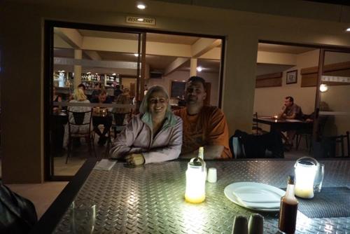 a man and woman sitting at a table in a restaurant at Pyramids Motel in Van Reenen