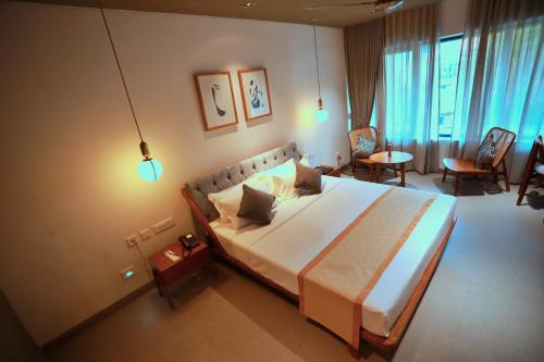 En eller flere senge i et værelse på E.05 City Inn