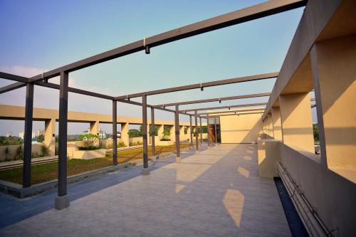 an external view of a building with a balcony at E.05 City Inn in Alwaye
