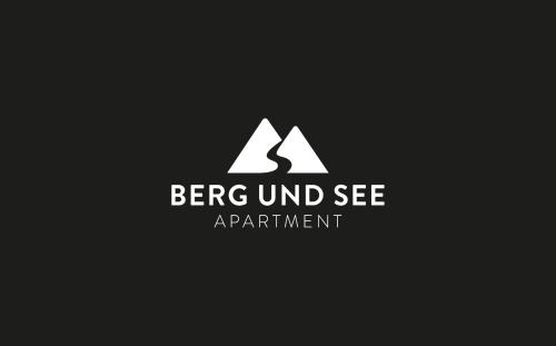 a logo for an apartment building with mountains at Apartment Berg und See in Schliersee