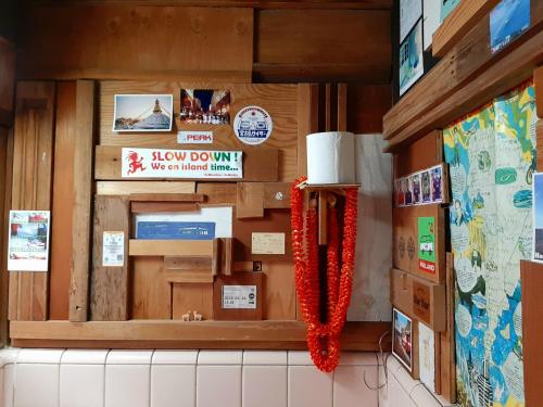 a restaurant with a window with signs on the wall at Guest House FUTARENO in Yokohama