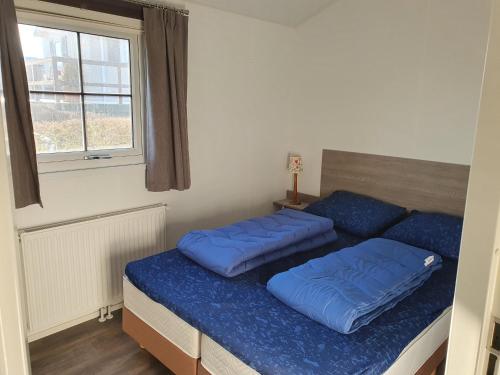 Postel nebo postele na pokoji v ubytování Chalet 11 - Bergzicht Teuven