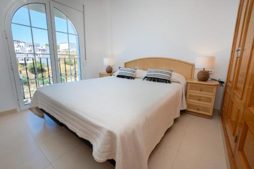 Postel nebo postele na pokoji v ubytování PENTHOUSE LAS GAVIOTAS II-2E Menyber