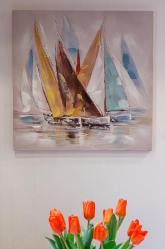 a painting of boats on the water with orange flowers at Stara Kala Varos Apartment in Split
