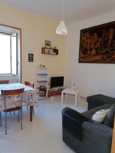 a living room with a couch and a table at Nido d'amore in Anagni
