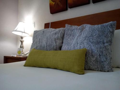 Una cama o camas en una habitación de Hotel Victoria