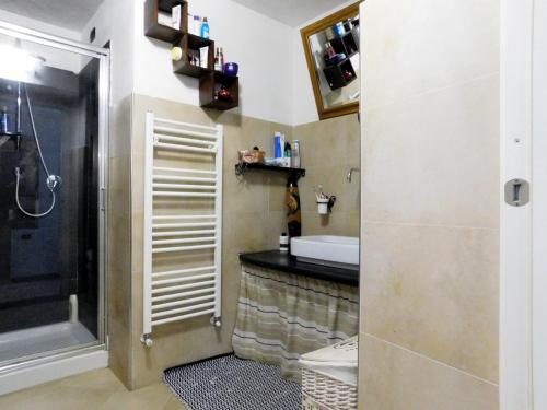 a bathroom with a shower and a sink and a toilet at Apartment Sant'Andrea in Levanto
