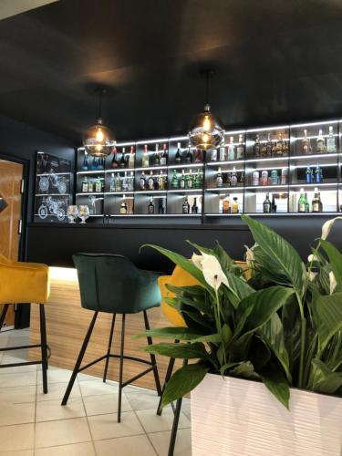 a dining room with a shelf of vases at Avila Park & SPA in Dziwnówek